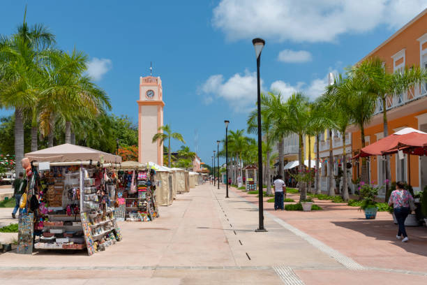 Cozumel main square with souvenir vendor booths, clock tower and colonial buildings